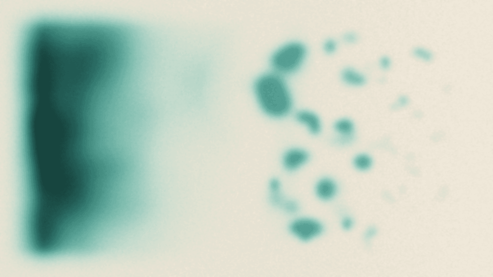 Abstract soft-focus colour field: a dense verdigris and deep teal mass crowds the left of the frame in coarse mottled clouds, thins as it moves right through a narrow band of seafoam, and dissolves almost entirely into pale warm sand across the right third, where only a few faint flecks of colour remain suspended in the empty ground
